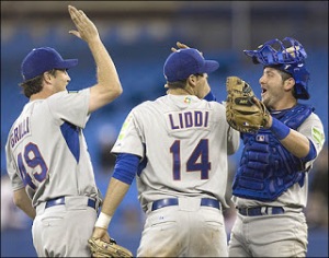 Team Italian Major Leaguers Jason Grilli, Alex Liddi and Francisco Cervelli celebrate after Grill held Canada scoreless for three innings and picked up the save in the 2009 WBC in Toronto.