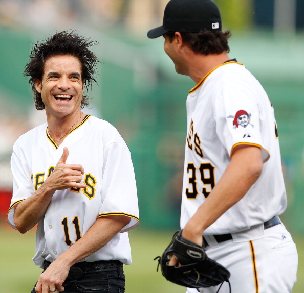 Train lead singer Patrick Monahan shares a laugh with Pirates' closer Jason Grill.