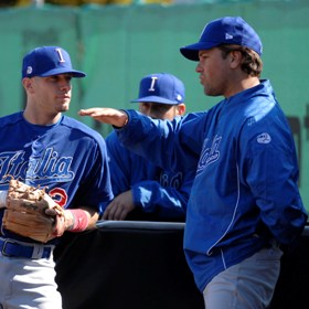 Team Italy hitting coach Mike Piazza gives some sound advice to infielder Anthony Granato in the 2010 European Baseball Championship Finals.