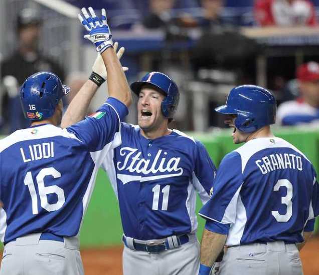 Padres' Chris Denorfia is congratulated by Orioles' Alex Liddi in the 2013 World Baseball Classic.