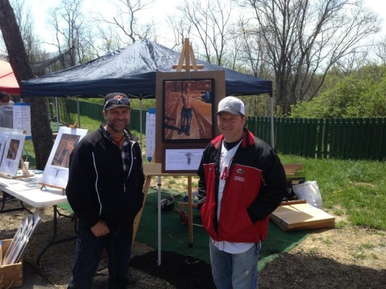 Artisit Chris Felix (left) at a Reid Rizzo Foundation fundraiser.