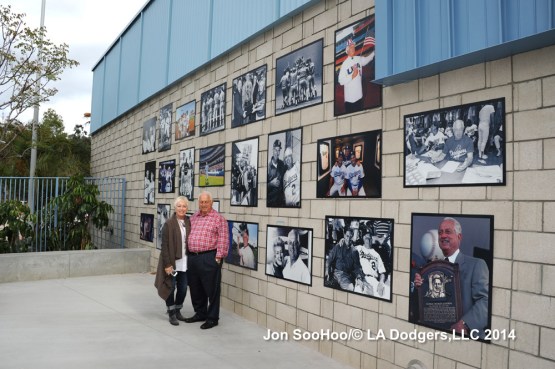 Standing with his daughter, Laura, Tommy poses near the Lasorda Tribute display at Dodger Stadium.