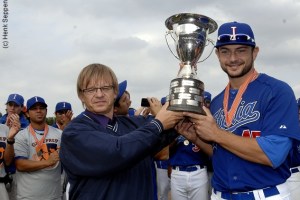 Team Italia captain Mario Chairini accepts the 2012 European Cup after the Italians beat the Netherlands.