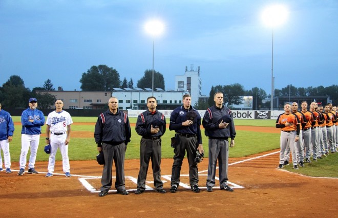 Team Italia manager Marco Mazzieri (second from left) with bench coach Marco Nanni (far left) prior to the Netherlands game on September 20, 2014 at Draci Ballpark in Brno, Czech Republic (Photo courtesy of Mister-Baseball.com).