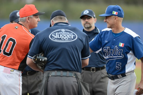 Kingdom of the Netherlands manager Steve Janssen and Italia manager Marco Mazzieri exchange lineup cards prior to the start of their game in the 2016 European Baseball Championship. (photo courtesy of Enzio /FIBS)